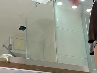 Miniskirt Lover Raver Girl Reveals Her Piercing on Her Pussy in the Bathroom by Lifting Her Short Skirt