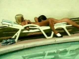Tempting babes sharing big dildo poolside