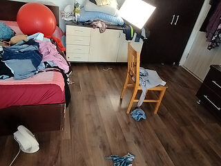 Sexy brunette doing naked chores around the house.