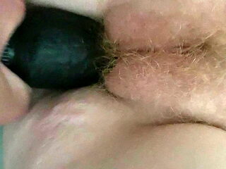 Ducking milf with black dildo until she cums