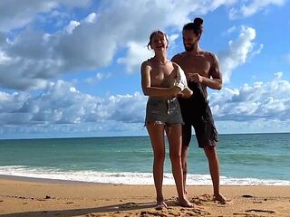 Tattooed hottie and her partner are naked on the beach