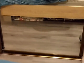 A Voyeuristic Stepmother in Tights Jerks off a Young Man and Receives His Sperm in Her Mouth.