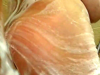 Camilla scrubs up in the shower