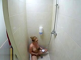 Solo female masturbation in the public gym shower