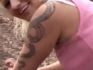 Mature blonde woman in fishnet fucked on the log