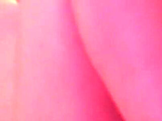 Short-haired blonde Emily masturbates on the bed