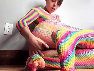 Teen in Rainbow Fishnets Fingers Herself