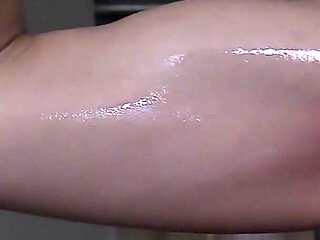 Naked Sportswoman Oils Herself up