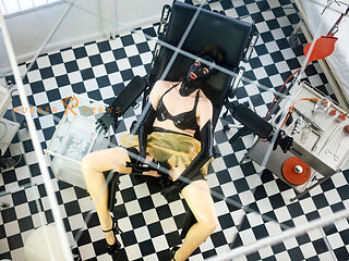 Rubberslut in the clinic masturbates with big dildo and deepthroats