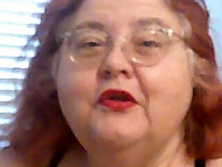 Mature BBW Redhead Nurse Vicki Talks to You as She Makes a Lipstick Applying Video for You!