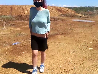 Girl undresses on a windy day