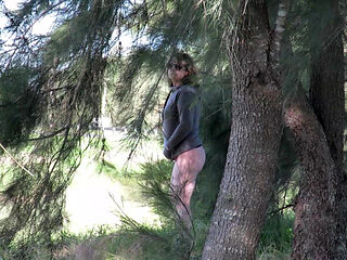 Patricia and her ass walks among the pines