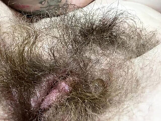 Hairy amateur girl masturbates her big clit close up - homemade pussy rubbing orgasm