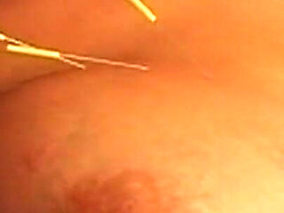 Busty Blonde MILF Submits to Intense Needle Play