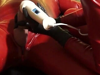 Latex Danielle in catsuit has latex masturbating games with her slave