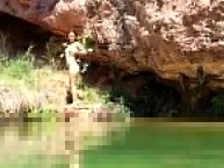 Wild girl posing naked and playing with herself outdoors