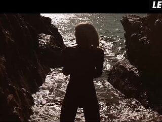 Blonde Beach Babe Rolls Nude in Sand Then Fingers Her Pussy