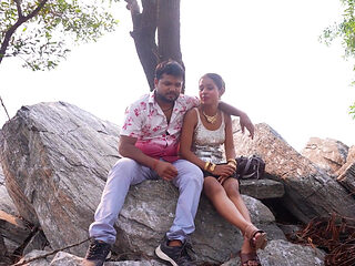 Couple Enjoy in River and Mountain