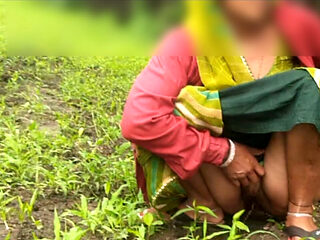 My big sister-in-law is walking around the farm, rubbing her fat ass and putting fingers in her pussy, urinating in the open wood.