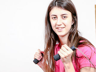 Butterface strips in home gym after a workout and fingers herself