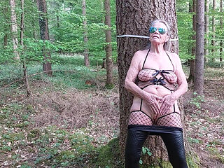 Granny Is Masturbating in the Woods!