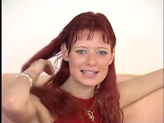 Gorgeous redhead babe is toying her pussy at the casting