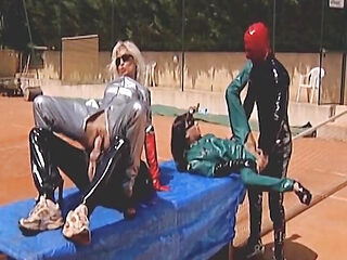 Latex German bitches assfucked and fisted in the foursome on the tennis court