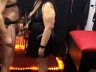 Dominatrix Locks Submissive's Throbbing Cock in Chastity Cage