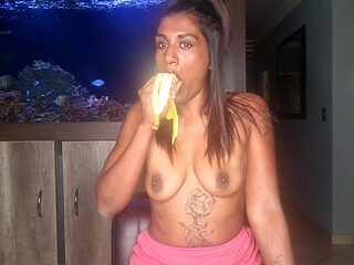 Topless Desi Squeezes Her Boobs as She Sucks and Deepthroats on a Banana