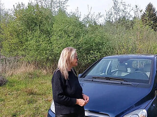 Granny with Big Natural Tits Plays with Her Breasts in Car