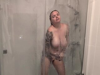 The Girl With Big Tits Takes A Shower And Masturbates