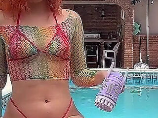Having Fun with Bubble Maker Nearby Pool