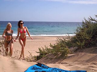 Isabella and Lovita's wild beach romp: sun-kissed skin, steamy 69 action, naughty as* play