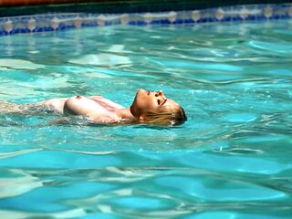 Redhead beauty nikki sweet enjoys passionate sex by the pool