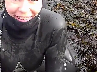 Rubbery Beach Encounter: Lucy's Neoprene Pussy Play with Stranger