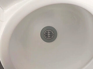 Moaning daddy has a lot of pressure and milks his cock in the public toilet