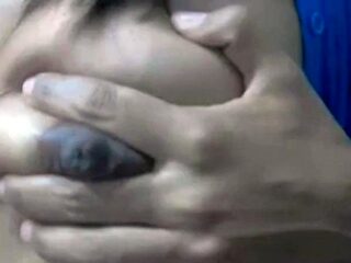 Squeezing Milk Out of Her Dark Nipples on Webcam