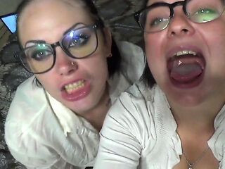 Two business women taunt you with their mouths & tongues before eating you whole!