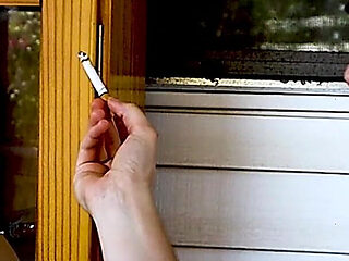 Shaved Head Goth Smokes Outside