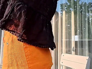 Hot Long Legs Sexy Beauty on the Balcony Flashes Her Panties Under Her Skirt Then Takes Underwear off to Show Tight Pussy