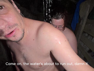 Soapy naked bodies in a rural shower