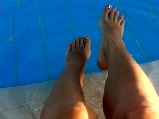 Barefoot Dangling in Swimming Pool Water