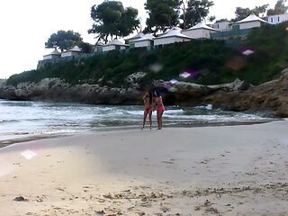 Beach babes enjoy a hot and steamy threesome on the sand