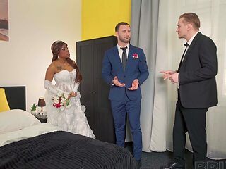 A beautiful black bride Vicky Menage gets married to a white man in a captivating scene.